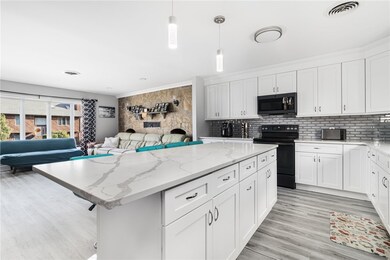 Kitchen with Stainless Steel Appliance and Open Fl