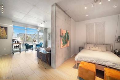 Bedroom with rail lighting