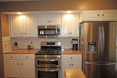 White cabinets, granite counters