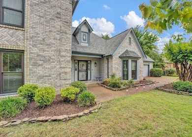 View of front of home featuring a front yard, roof