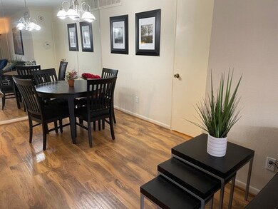 Open floor plan dining leads to living room area.
