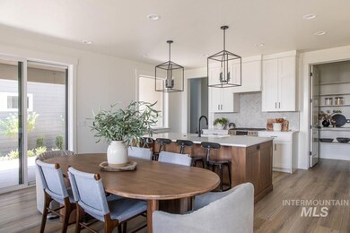 Dining area with light wood-type flooring, recessed lighting, and a chandelier