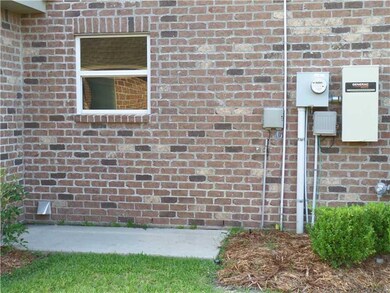 Exterior Back. Generator hookup and pad