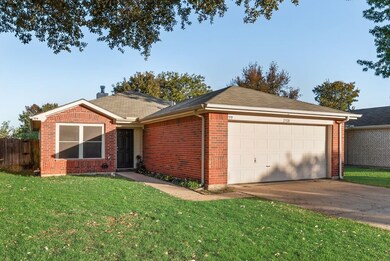 Ranch-style house with brick siding, concrete driveway, and an attached garage