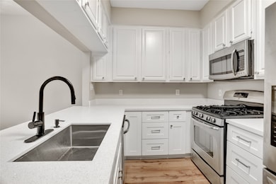 Here’s a closer view of the kitchen, showcasing the ample counter space, extensive cabinetry, and the gas range — a great feature for those who enjoy cooking with precision and efficiency.