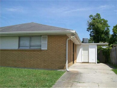 Photo. Exterior side of 8643 Gervais.  Storage roo
