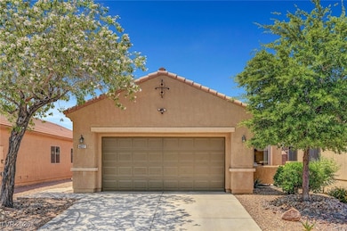 View of front facade with concrete driveway, stucc