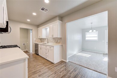 Kitchen - Wood Grain Tile, Quartz Counter Tops, Ne
