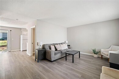 Living room is bright and has plenty of space.
