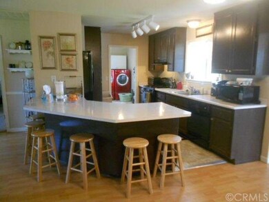 full kitchen, beyond is laundry room