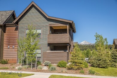 Landscaped side patio with view of Lone Peak
