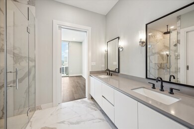 Primary retreat with porcelain floors and double s