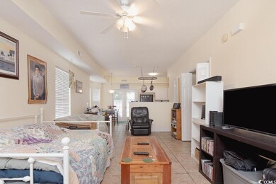 Tiled living room with ceiling fan