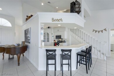 Kitchen featuring a kitchen bar, kitchen peninsula
