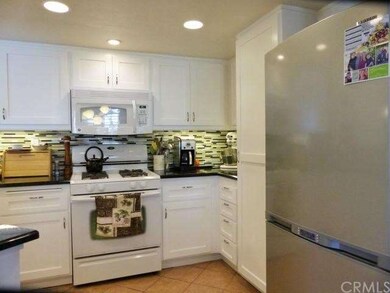 Kitchen with tile flooring, recessed lighting, und
