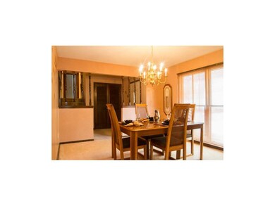 Formal dining room with floor to ceiling windows, 