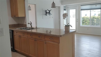 Kitchen features multiple drawers and organizer pull outs in cupboards.