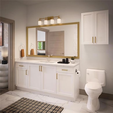 Bathroom with vanity and light marble finish flooring