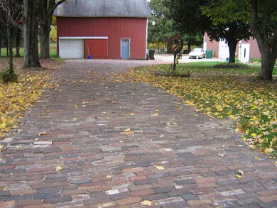 All of driveway is brick which leads to 1917 barn!
