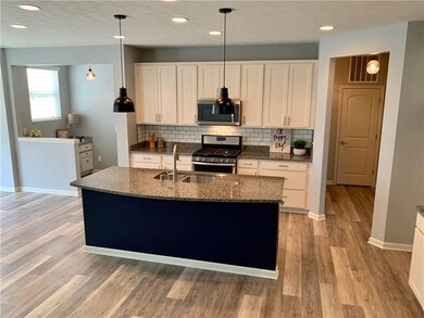Center island with breakfast bar. 