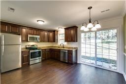 Large kitchen. This is a similar home. The kitchen will have a small island at the center.