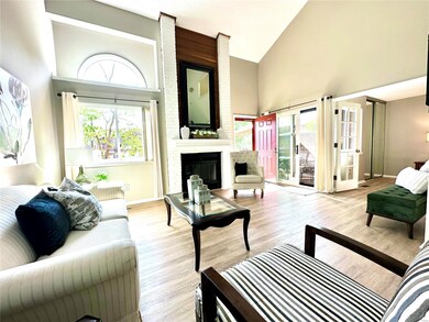 The living room has a gorgeous fireplace that span