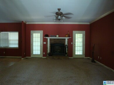Features a gas log fireplace.