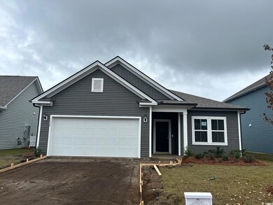 View of front facade featuring a garage and a fron