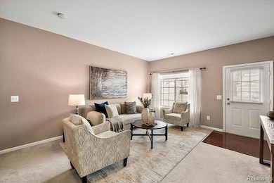 Living room with baseboards and dark carpet
