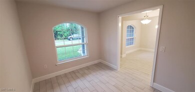 Empty room with light hardwood / wood-style floors