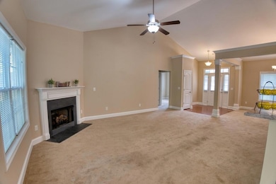 Unfurnished living room featuring carpet floors, a