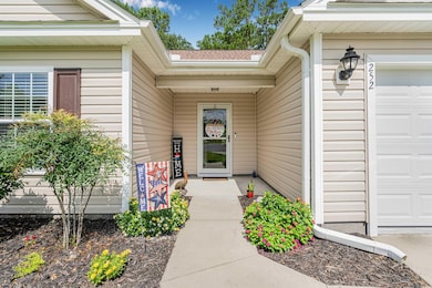 Doorway to property featuring an attached garage