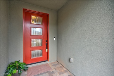 Doorway to property with stucco siding