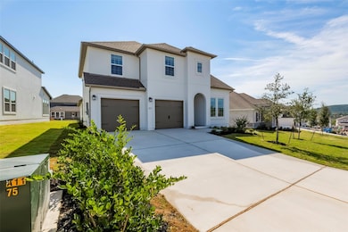 Traditional-style house featuring a front lawn, a garage, roof with shingles, and concrete driveway