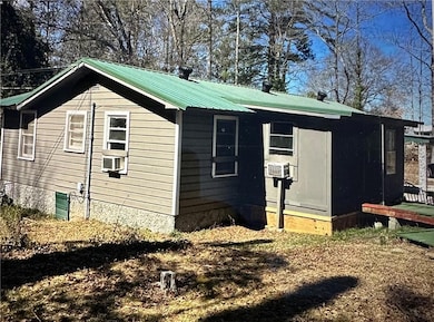 View of home's exterior featuring a metal roof