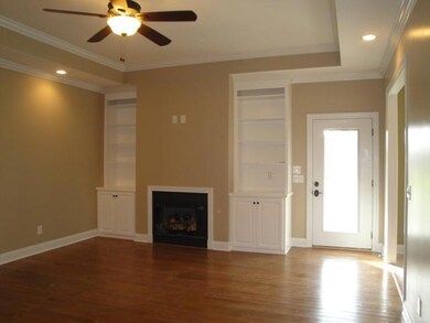 Living Room Features hardwood flooring, Built In Shelving, Gas Fireplace, Recessed Lighting,& access to Covered back porch