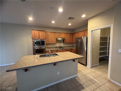 Kitchen featuring stainless steel appliances, a br