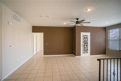 Living room with a ceiling fan, recessed lighting,