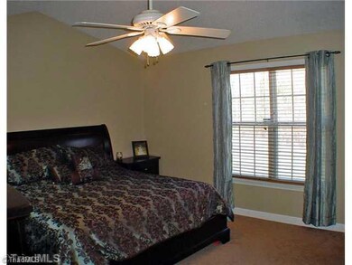 Master Bedroom. Light and airy with vaulted ceiling and cooling fan, the feeling of space is not an illusiion in this comfortable master suite.  It easily accommodates a king size bed and additional pieces.  The master bath is just a step away.