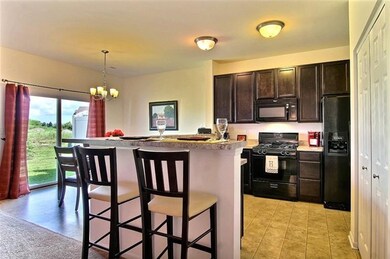 VIEW OF KITCHEN AND BREAKFAST BAR