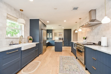 This kitchen features a modern design with sleek n