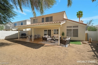 Back of house with outdoor lounge area, stucco siding, a patio, and a tiled roof
