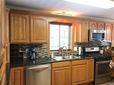 Beautiful kitchen with ample storage, granite coun