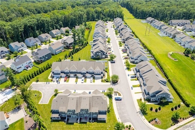Aerial view of residential area featuring a forest