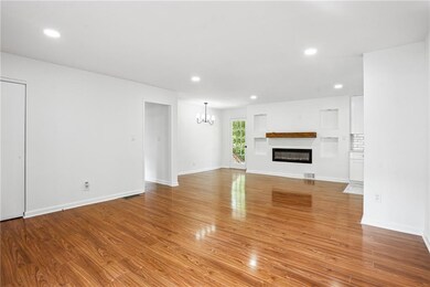 Unfurnished living room featuring visible vents, r