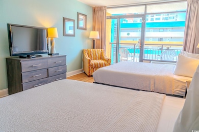 Bedroom featuring light wood-style flooring and baseboards