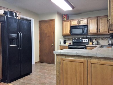 Kitchen view showing door to laundry room.