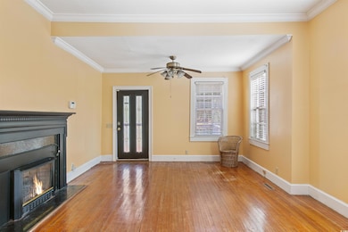 Unfurnished living room with baseboards, ornamenta