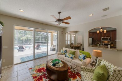 Sliding doors out to the lanai with pool and spa.