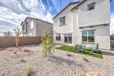 Rear view of property featuring stucco siding and a fenced backyard